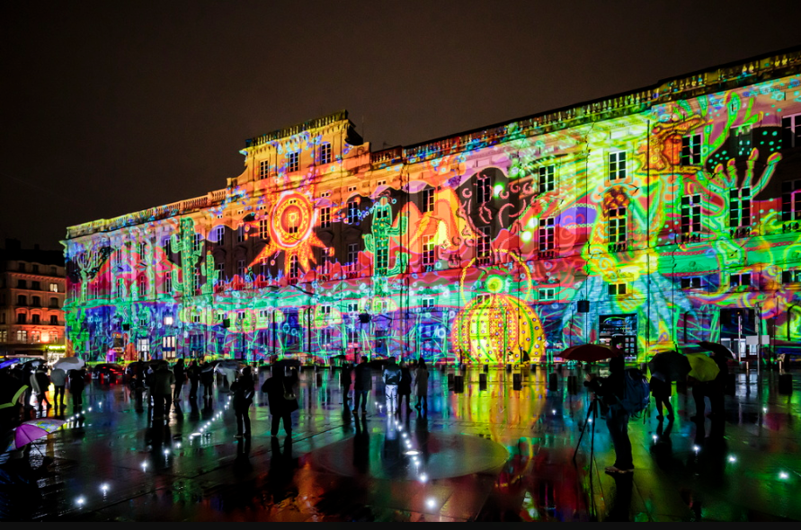 Light projection on Palais de la Bourse during Lyon’s Festival of Lights.