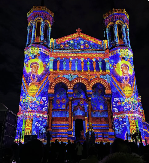 Vibrant light projection on Fourvière Basilica during Lyon’s Festival of Lights
