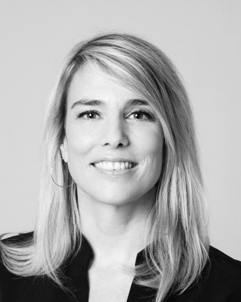 Portrait of Vicky Robini, French fixer and location scout based in the Rhône-Alpes region, smiling in a professional setting